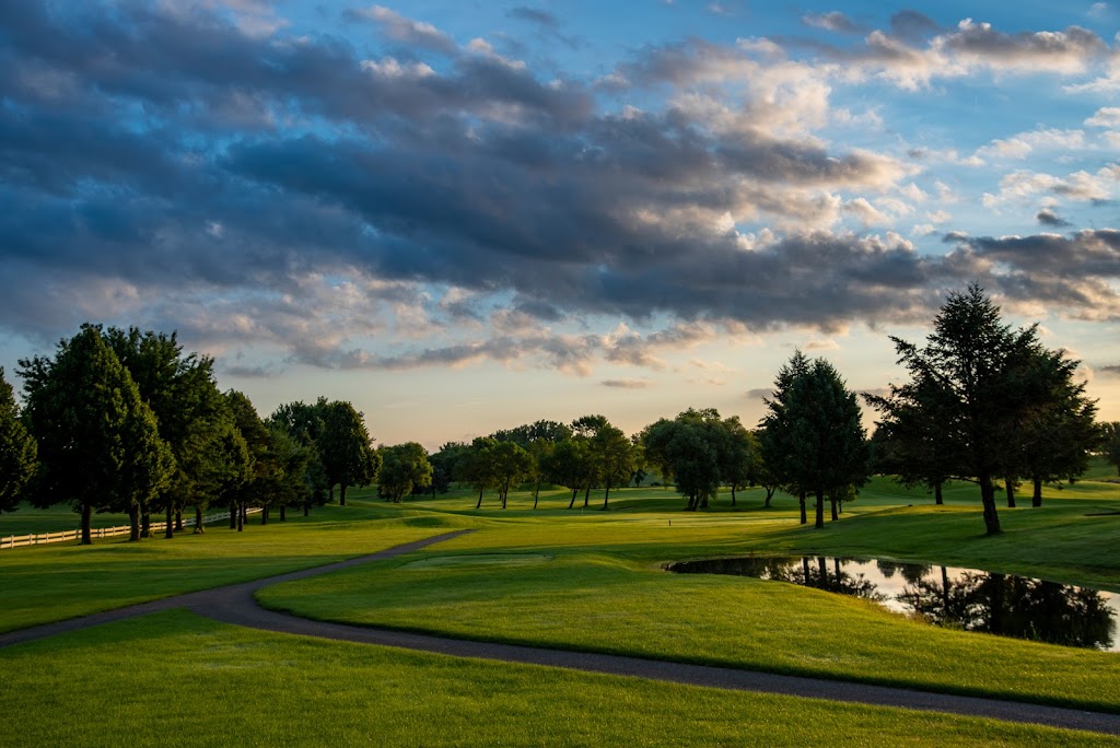 Panoramic view of a lush green golf course at Southern Hills Golf Course. Smooth