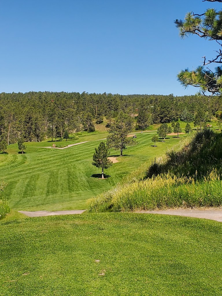 Panoramic view of a lush green golf course at Southern Hills Golf Course. Smooth