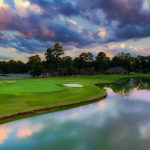Panoramic view of a lush green golf course at Southern Landings Golf Club. Smooth