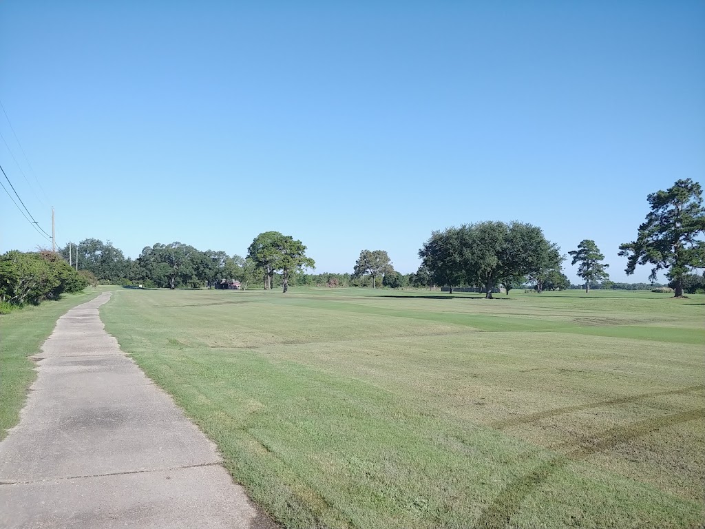 Panoramic view of a lush green golf course at Southern Oaks Country Club. Smooth