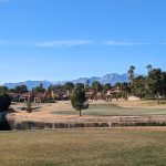 Panoramic view of a lush green golf course at Spanish Trail Private Country Club. Smooth