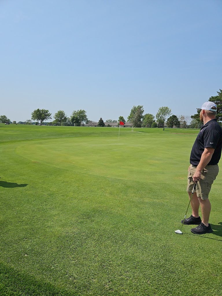 Panoramic view of a lush green golf course at Spencer Municipal Golf Course. Smooth