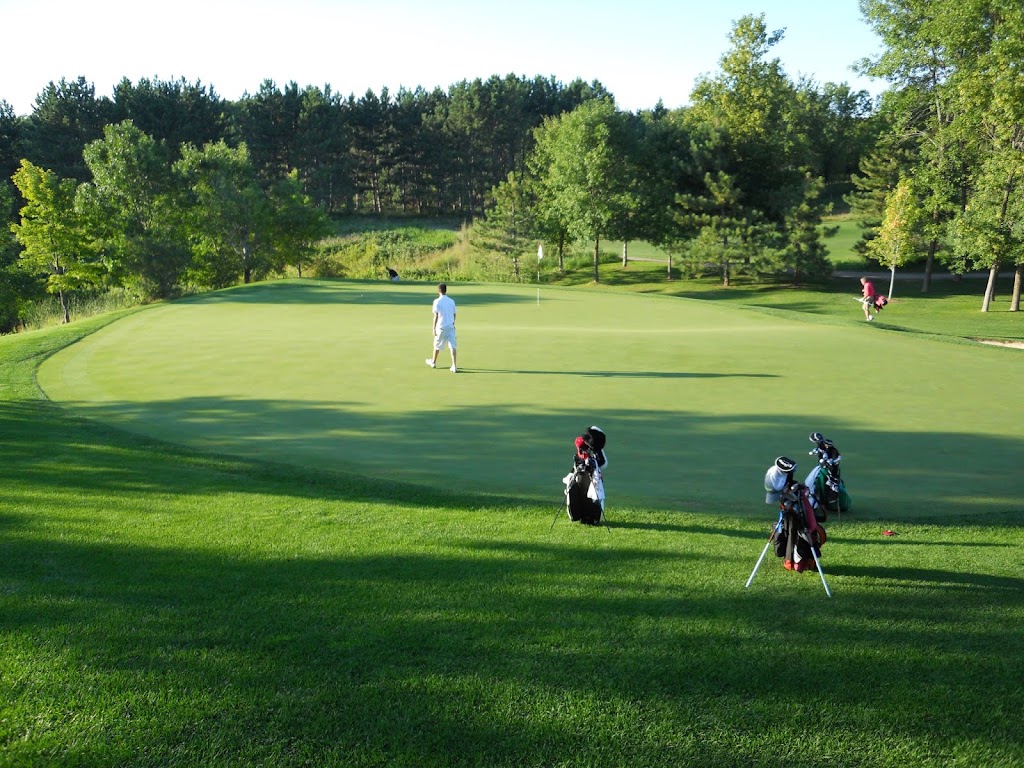 Panoramic view of a lush green golf course at Spring Hill Golf Club. Smooth
