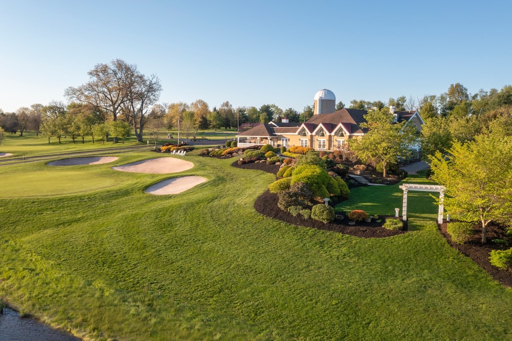 Panoramic view of a lush green golf course at Spring Hollow Golf Club. Smooth