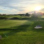 Panoramic view of a lush green golf course at Spring Valley Golf Club. Smooth