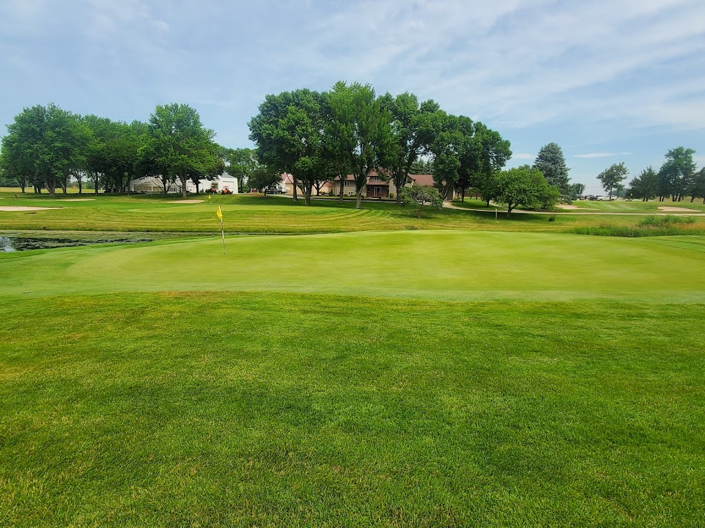 Panoramic view of a lush green golf course at Spring Valley Golf Course. Smooth