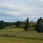 Panoramic view of a lush green golf course at Springbrook Golf Club. Smooth
