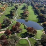 Panoramic view of a lush green golf course at St. Andrews Golf and Country Club. Smooth