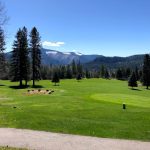 Panoramic view of a lush green golf course at St Maries Golf Course. Smooth