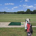 Panoramic view of a lush green golf course at Stagg Hill Golf Club. Smooth