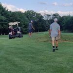 green grass with the flag in the hole.