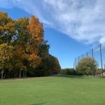 Panoramic view of a lush green golf course at Stanley Golf Course. Smooth