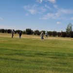 Panoramic view of a lush green golf course at Starcity Golf Course. Smooth