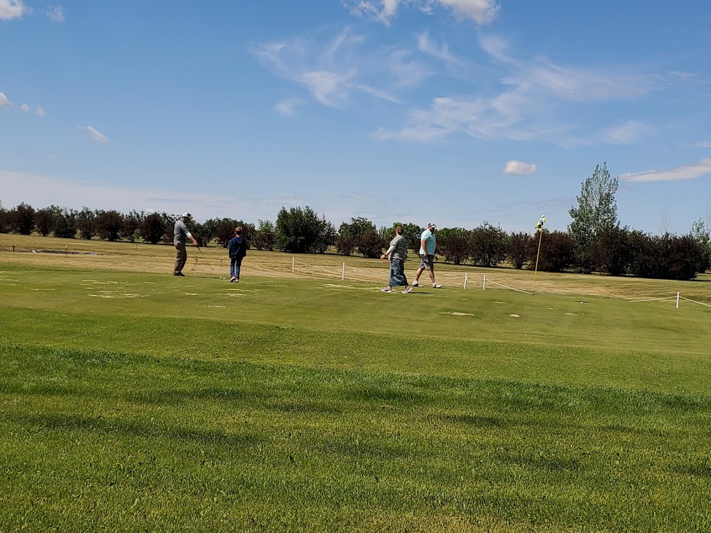 Panoramic view of a lush green golf course at Starcity Golf Course. Smooth