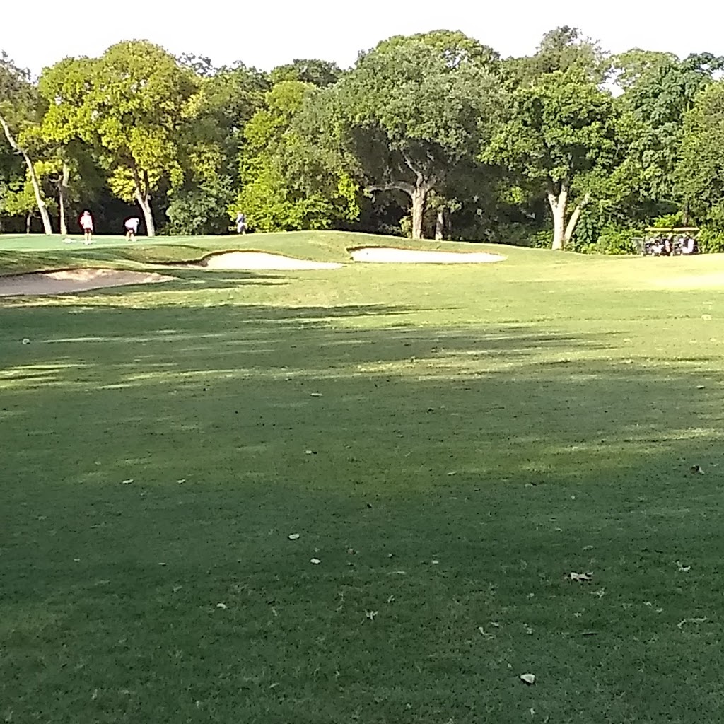 Panoramic view of a lush green golf course at Starcke Park Golf Course. Smooth