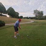 green grass with the flag in the hole.