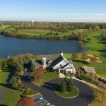 Panoramic view of a lush green golf course at Steeple Chase Golf Club. Smooth