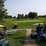 green grass with the flag in the hole.