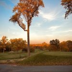 Panoramic view of a lush green golf course at Sterling Farms Golf Course. Smooth
