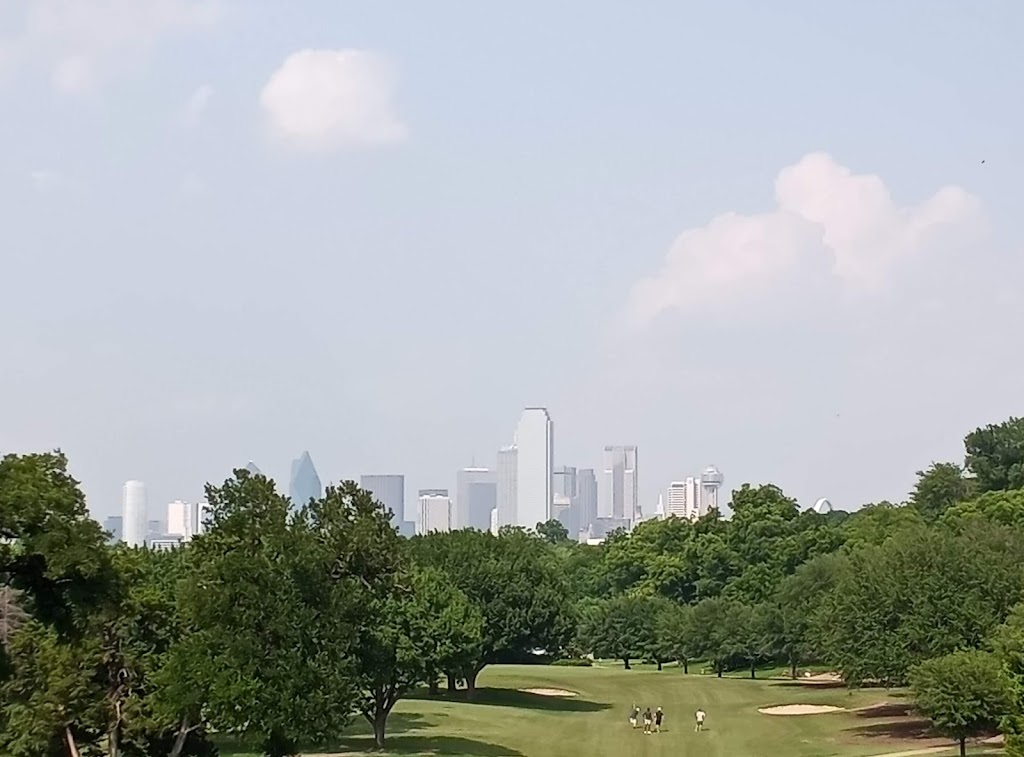 Panoramic view of a lush green golf course at Stevens Park Golf Course. Smooth