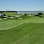 green grass with the flag in the hole.
