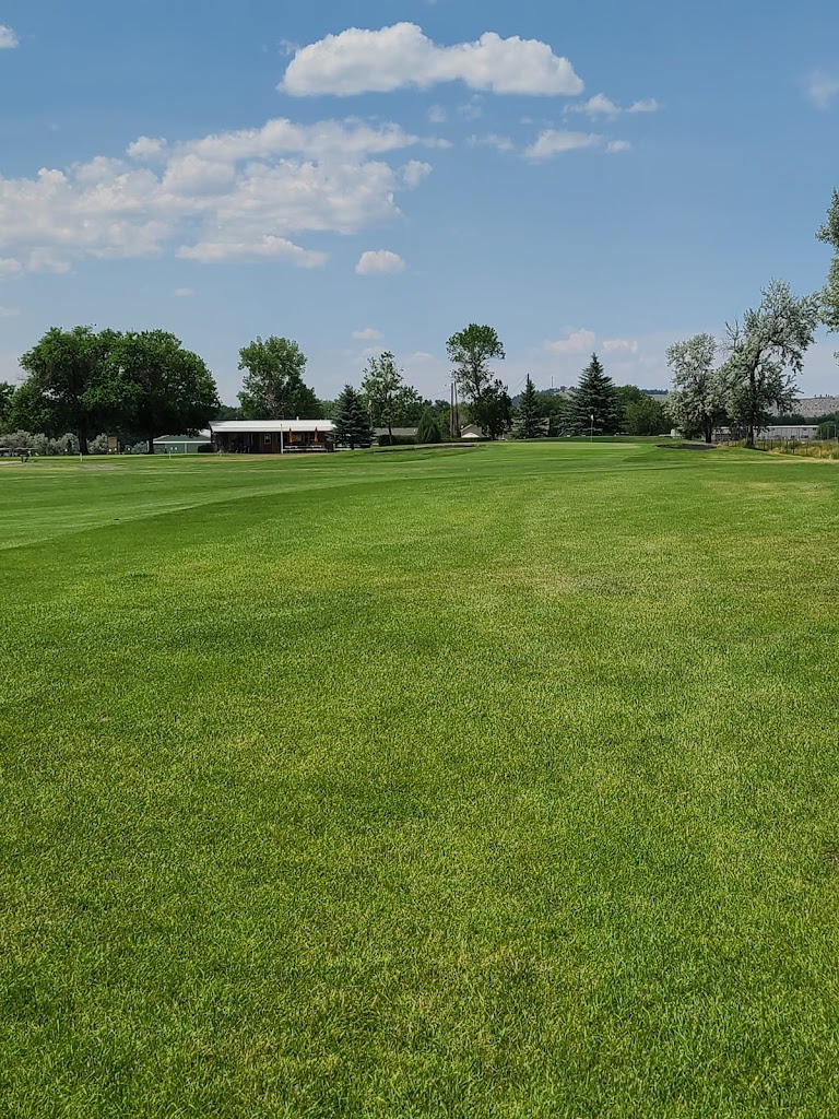 Panoramic view of a lush green golf course at Stillwater Golf. Smooth