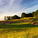 Panoramic view of a lush green golf course at Stoatin Brae Golf Club. Smooth