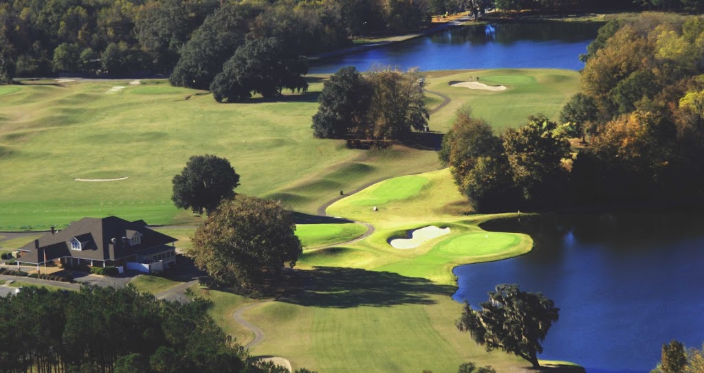 Panoramic view of a lush green golf course at Stone Creek Golf Club. Smooth