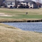 Panoramic view of a lush green golf course at Stone Creek Golf Course. Smooth