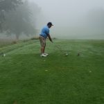 green grass with the flag in the hole.