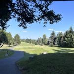 Panoramic view of a lush green golf course at Stoneridge Golf Club. Smooth