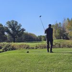 green grass with the flag in the hole.