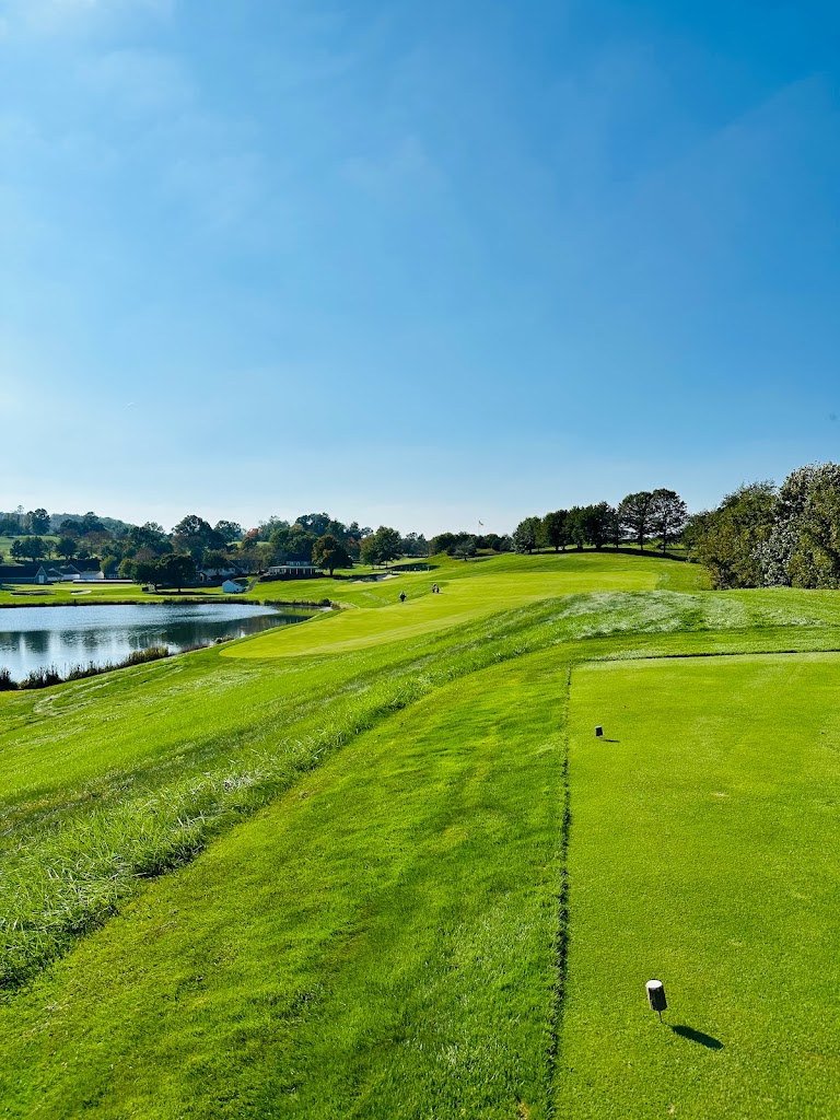 Panoramic view of a lush green golf course at Stonewall. Smooth
