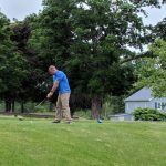 green grass with the flag in the hole.