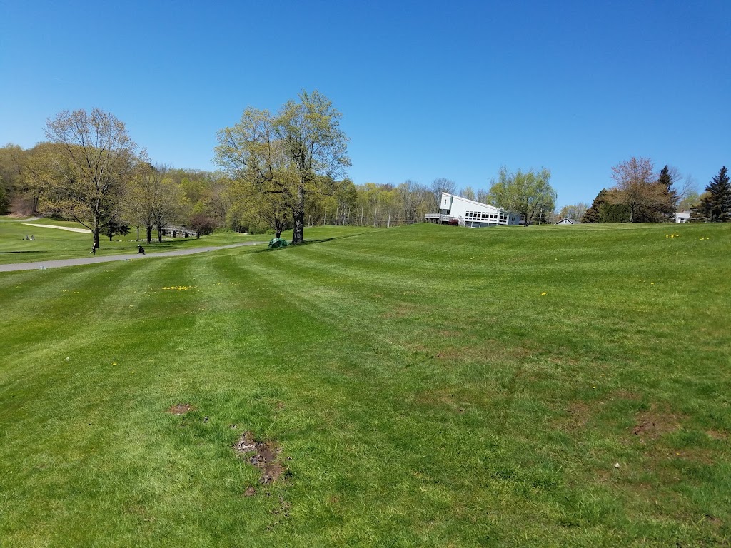Panoramic view of a lush green golf course at Stonybrook Golf & Clubhouse Provisions. Smooth