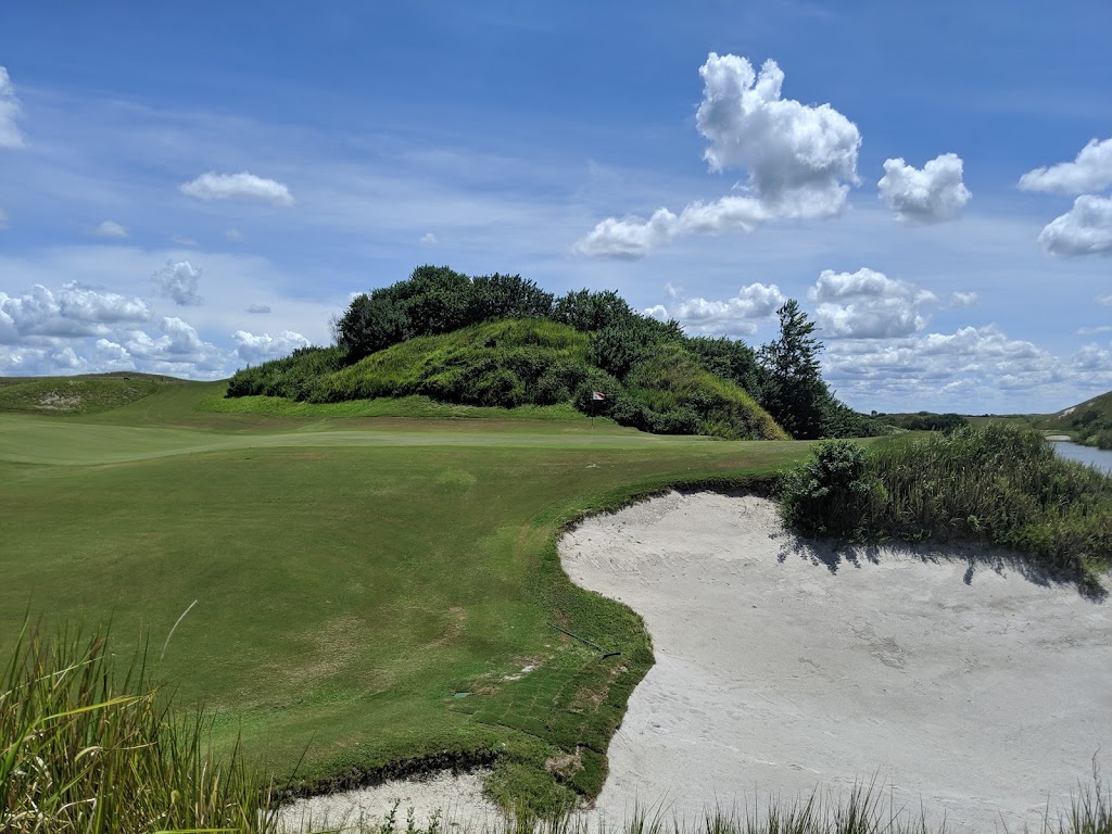 Panoramic view of a lush green golf course at Streamsong Golf Course Red. Smooth