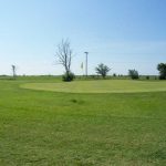 Panoramic view of a lush green golf course at Stroud Municipal Golf Course. Smooth