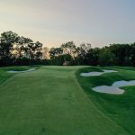 Panoramic view of a lush green golf course at Suburban Golf Club. Smooth