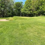 Panoramic view of a lush green golf course at Sullivan County Golf Club. Smooth
