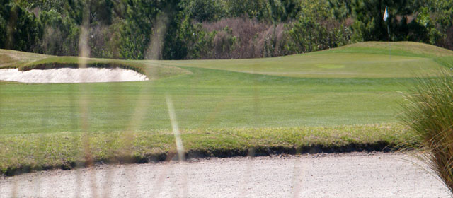 Panoramic view of a lush green golf course at Summerfield Crossings Golf Club. Smooth