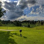 green grass with the flag in the hole.