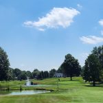 Panoramic view of a lush green golf course at Summit Hills Country Club Inc. Smooth