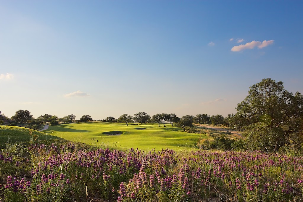 Panoramic view of a lush green golf course at Summit Rock Golf Course. Smooth