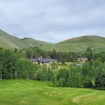 Panoramic view of a lush green golf course at Sun Valley Golf Course. Smooth
