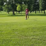 Panoramic view of a lush green golf course at Sun Valley Golf Course. Smooth