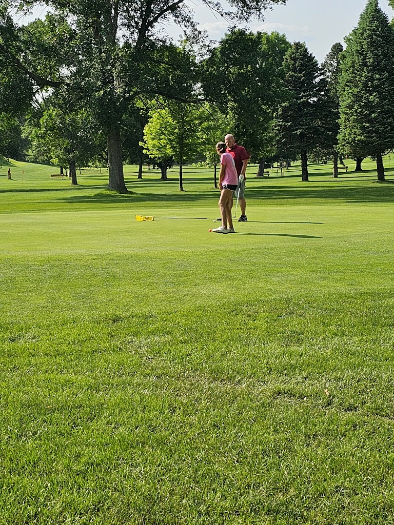 Panoramic view of a lush green golf course at Sun Valley Golf Course. Smooth