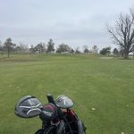 green grass with the flag in the hole.