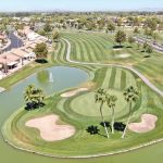 Panoramic view of a lush green golf course at Sunbird Golf Club. Smooth