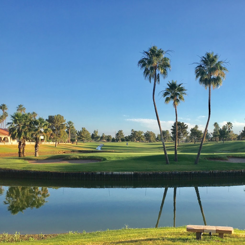 Panoramic view of a lush green golf course at Sunbird Golf Club. Smooth