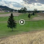 green grass with the flag in the hole.